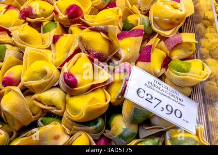Close up of fresh, hand made pasta, tortelloni bufala e crudo ,mozarella and ham tortelloni on sale at a shop in Bologna,Italy Stock Photo