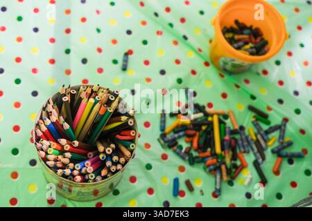 Colored pencils in a large jar on the table. High quality photo Stock Photo