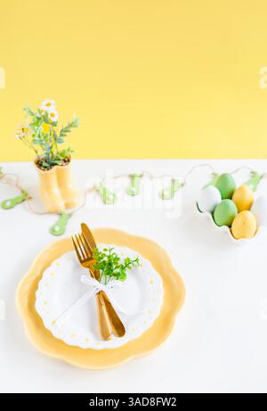 Happy Easter. Easter celebration concept. Top view vertical empty dishes Easter eggs, on isolated pastel background. Copy space, place for text, banne Stock Photo