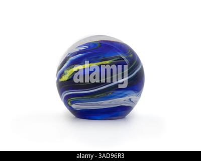 Large blue glass marble with yellow and white swirls. Beautiful glass ball or sphere. Used as spiritual crystal ball, decoration or paperweight. Selec Stock Photo