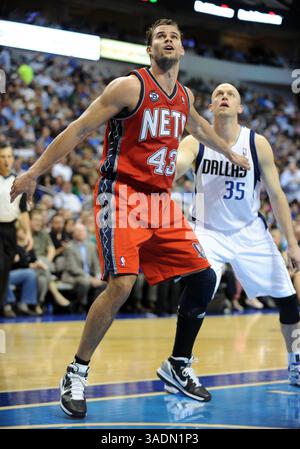 New Jersey Nets power forward Shelden Williams (33) is hit