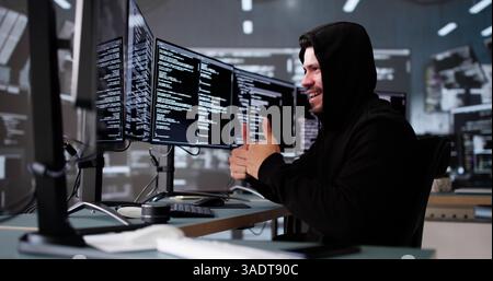 Celebrating A Win, The Young Latino Hacker Cheers At His Screen. Stock Photo
