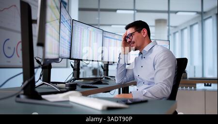 Data Analyst African Man Using Spreadsheet On Computer Stock Photo