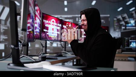 Ransomware Cyber Attack On Hacker Computer. Virus on Screen Stock Photo