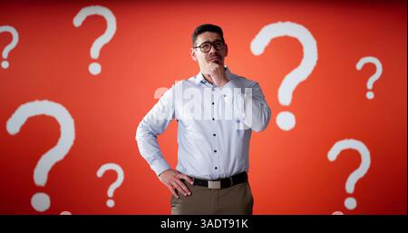 Lost Business Man And Question Marks. Employee Choosing Career Stock Photo