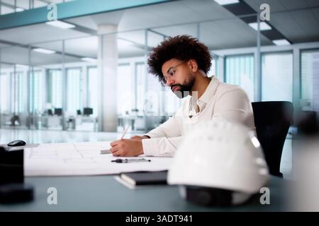 Busy African American Man Discussing Urban Construction Design Project Plan Stock Photo