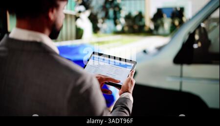 Black insurance agent inspects car crash damage for accident claim. Stock Photo