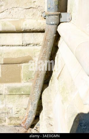 Old drain pipe at Salisbury Cathedral made by Maundrell foundries of Calne Stock Photo