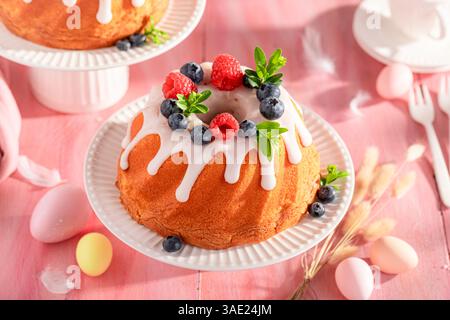 Homemade ring cake for Easter with festive spirit decor. Easter treat and holiday decorations. Stock Photo