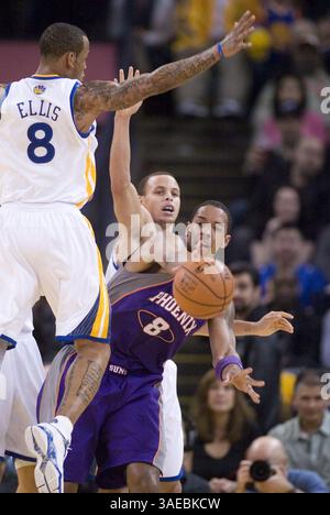 Feb. 13, 2012 - Oakland, CA, USA - Phoenix Suns Channing Frye, right, tries to pass around Golden State Warriors defenders Monta Ellis (8) and Stephen Curry during the second quarter of an NBA basketball game, Monday, February 13, 2012 at Oracle Arena in Oakland, California. (Credit Image: © D. Ross Cameron/Contra Costa Times/MCT/ZUMAPRESS.com) Stock Photo