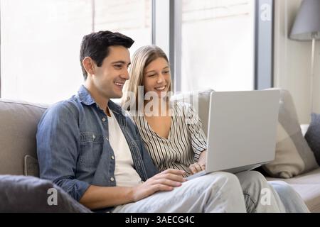 Beautiful young couple do online shopping using laptop Stock Photo