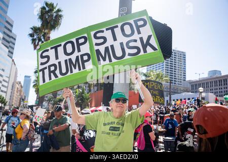A demonstrator holds a sign reading “On saigne tous de la même couleur ...