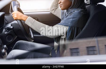 Tired African Muslim Lady Driving Car, Having Headache And Feeling Sleepy Stock Photo