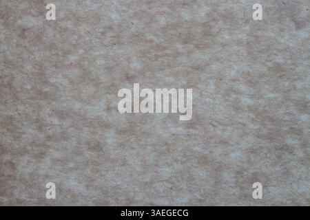 Recycled brown packing paper texture. Brown caotic fibers on the beige background. Wrapping paper. Stock Photo