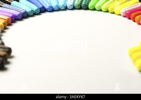 Colored markers placed in a circle on a white background with copy space Stock Photo