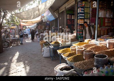 Sep. 26, 2011 - Kunduz, Afghanistan - Vendors stand in the doorway of their booths selling grains, spices, nuts, and other goods at a bazar in the city. (Credit Image: © Ton Koene/ZUMAPRESS.com) Stock Photo