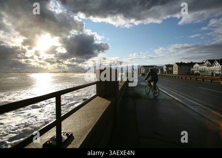 Jan 13, 2012 - Hampton, New Hampshire, U.S. - The sun shines through dark clouds at Hampton Beach, NH. The seacoast of New Hampshire endured strong winds and white-capped waves after a burst of wintry weather hit New England, Friday, January 13, 2012. (Credit Image: © Scott P. Yates/ZUMAPRESS.com) Stock Photo
