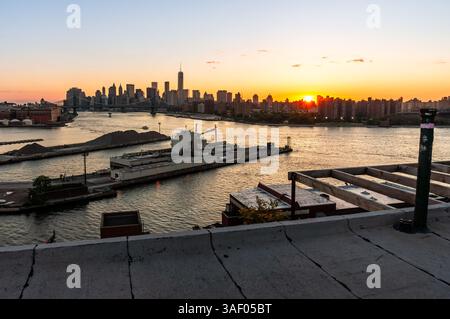 View of the Manhattan Island and the skyline of New York City from Williamsburg during sunset Stock Photo