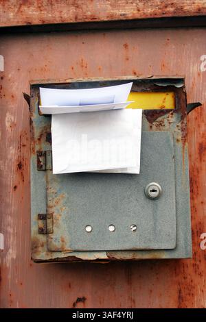 Old rusted post mail box Stock Photo