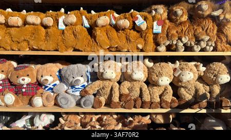 Scottish themed soft toys displayed for sale in Edinburgh. Tourist souvenir Scottish theme, over tourism, commercial Stock Photo