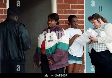 OT 117713 - - DELIVER TO: A or METRO - - 1/30/2001 MARIANNA CAPTION INFO: (From left) Harvey Williams (cq), a BASIC Prevention Case Manager, administers a saliva based oral HIV test to Charmaine Taylor (cq) (second from left), 20, while Fannette Brown (cq), 17, receives female condoms and an explanation of their use from Matilda McNair (cq) (Credit Image: St Petersburg Times/ZUMAPRESS.com) Stock Photo