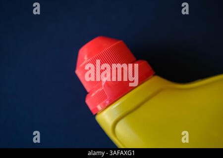 London UK, April 07 2025, Abstract Of Red Top On A Yellow Plastic Bottle Stock Photo