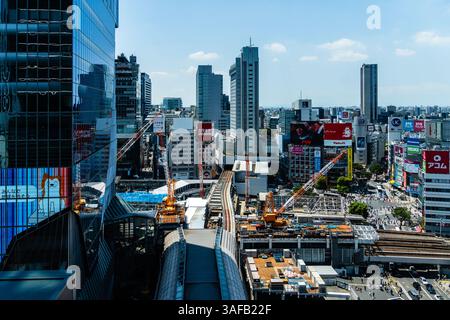 Tokyo, Japan - August 4, 2024: A dynamic view of Shibuya, showcasing modern buildings, construction, and the bustling energy of Tokyo, Japan. Stock Photo