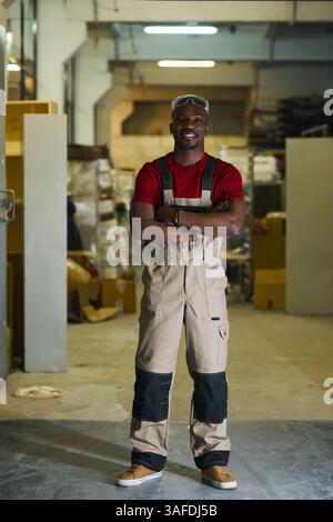 Factory Worker Standing In Workshop Stock Photo