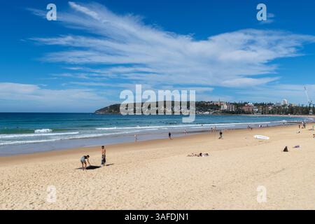 Manly Beach, on the northern beaches of Sydney, autumn blue skies over people relaxing on this world famous surf beach and tourist destination, Stock Photo