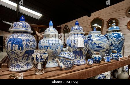Chinese blue and white pottery selection comprising ginger jars, storage jars and teapots. English antique shop display Stock Photo