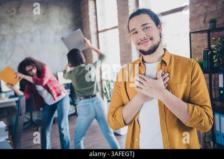Office team in casual environment working together, featuring friendly and candid interactions in a bright and dynamic setting Stock Photo