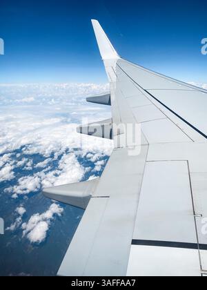 An airplane window view of wing and flaps after landing Stock Photo - Alamy