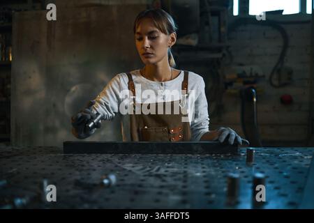 Worker Making Metal Details In Workshop Stock Photo