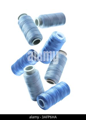 Different Blue Threads Blue threads of different shades on white background Stock Photo - Alamy