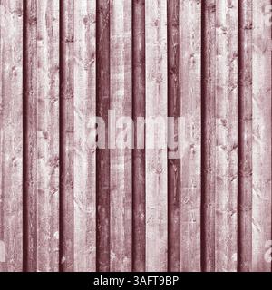 Close-up view of weathered wooden planks creating a rustic red background.Belarus Stock Photo