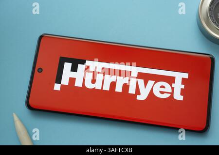 The logo of the hurriyet is displayed on a smartphone screen Stock Photo