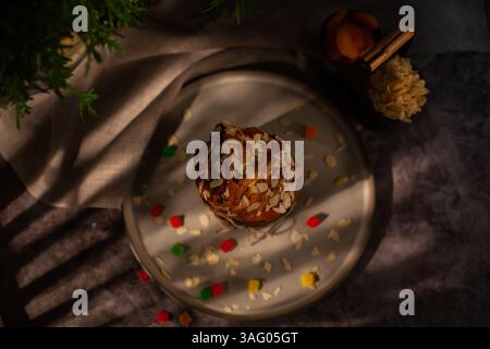 Top view of a plate of Easter crafin. Happy Easter holiday. Easter cupcake on dark background Stock Photo