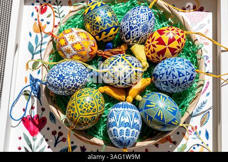 A vibrant collection of Easter eggs showcases traditional Ukrainian pysanky, each egg meticulously decorated with colorful folk patterns. Stock Photo
