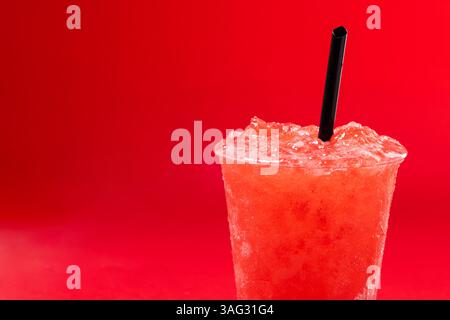 Red strawberry slushie isolated on red background Stock Photo