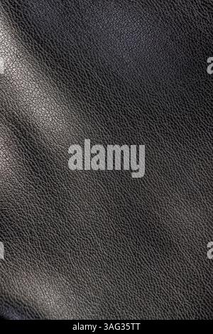 leather fabric for clothing, a part of synthetic fabric used for sewing trousers and other types of fashionable clothing Stock Photo