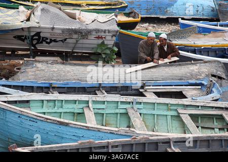 March 29, 2012 - Taghazout, Morocco - Two men repair a boat in Taghazout, Morocco. (Credit Image: © Julia Cumes/ZUMAPRESS.com) Stock Photo