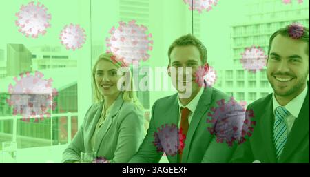 In office, business professionals discussing strategies, smiling during pandemic meeting Stock Photo