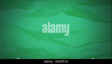 Image of creased green fabric or paper textured background moving in waves Stock Photo