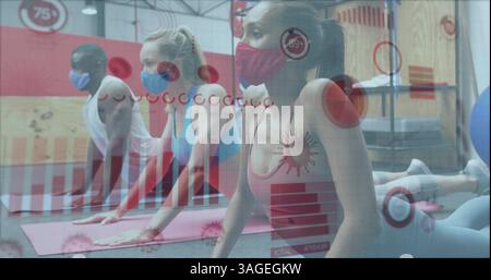Coronavirus statistical data processing against fit people performing stretching exercise at gym Stock Photo