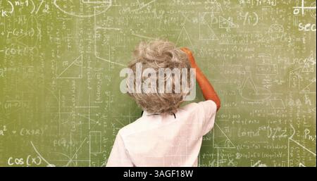 Image of floating mathematical equations over teacher writing on blackboard Stock Photo