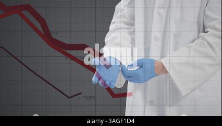 Financial data processing against mid section of doctor wearing surgical gloves Stock Photo