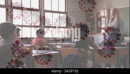 Covid 19 cells floating against female teacher wearing teaching using digital tablet at school Stock Photo