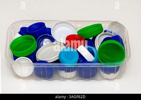 Pile of colorful plastic bottle caps ready for recycling Stock Photo