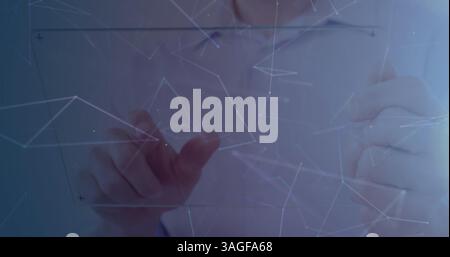 Image of networks of connections over businessman touching interactive screen in background Stock Photo