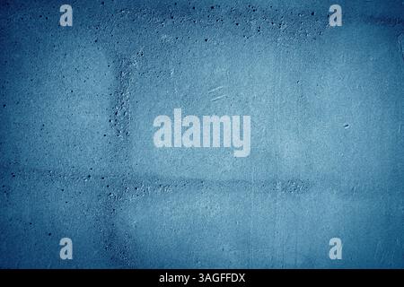 surface with a dark blue color featuring a rough, uneven texture Stock Photo